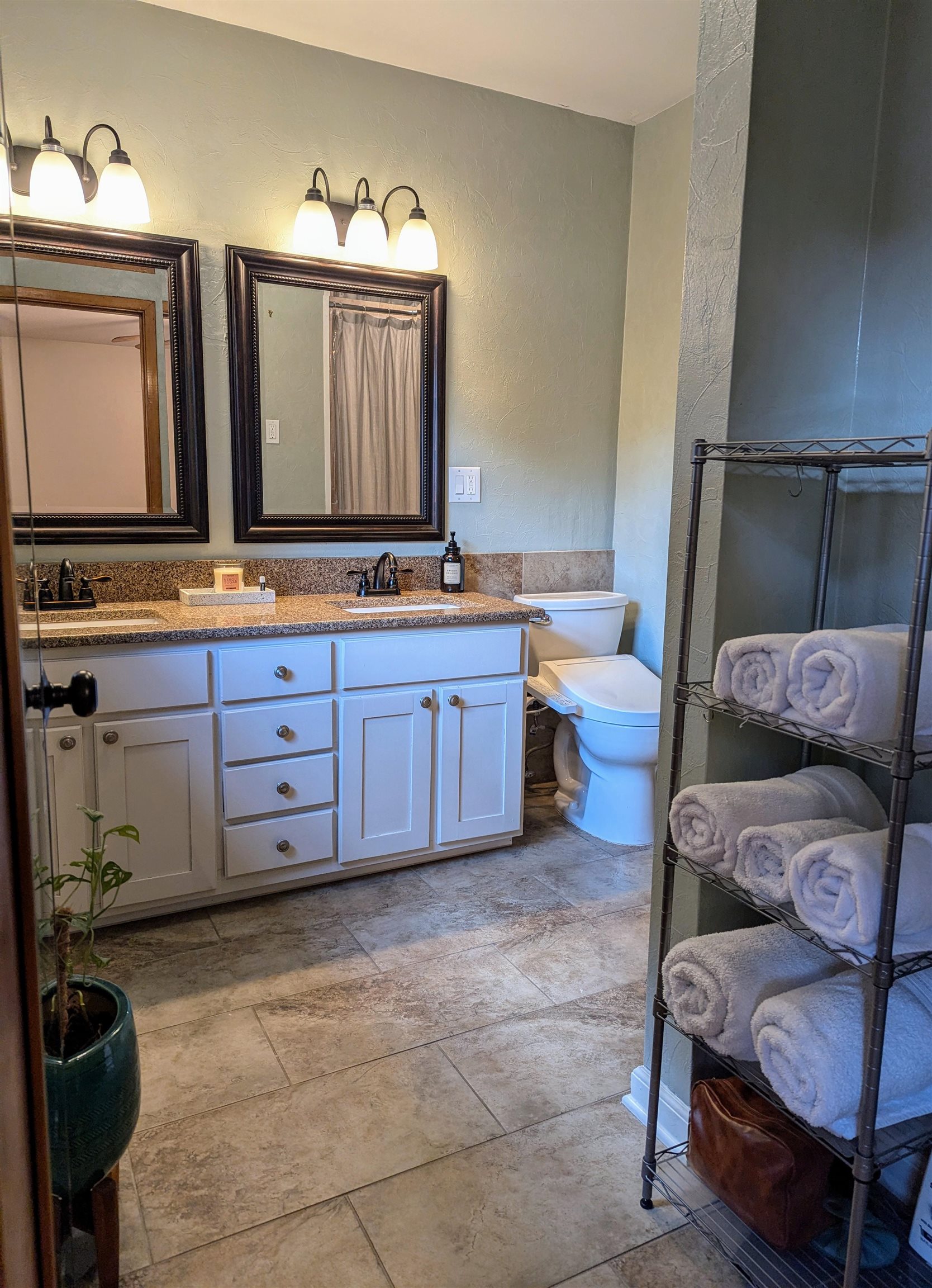 1604 Wilbec Road Memphis, TN 38117 - Photo 10 of 30 a bathroom with a granite countertop double vanity sink and a mirror