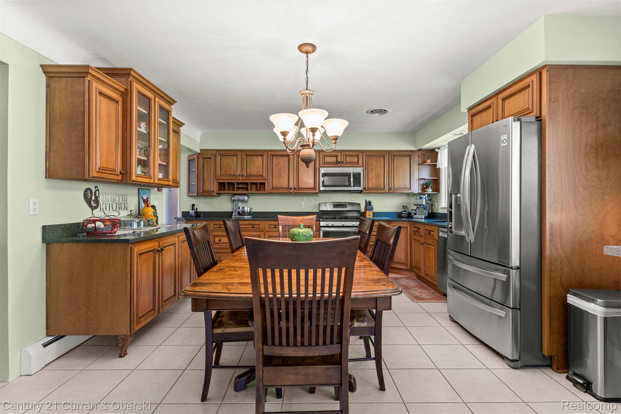 38894 South Huron Road New Boston, MI 48164 - Photo 10 of 44 Kitchen with wood finish cabinets, stainless steel appliances, suspended lighting, and light tile patterned flooring