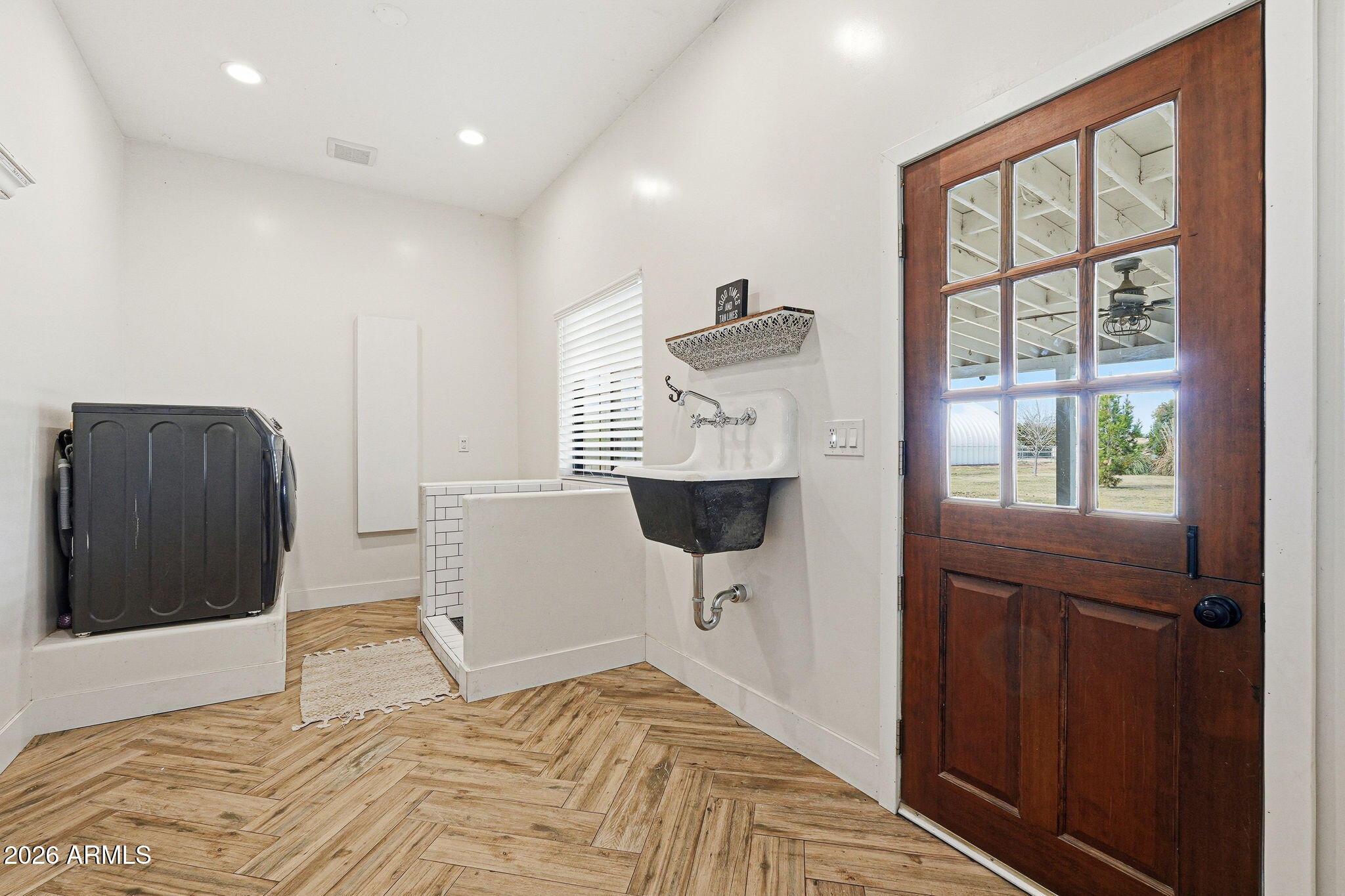 2858 East Redfield Road Gilbert, AZ 85234 - Photo 41 of 60 a bedroom with a bed and wooden floor