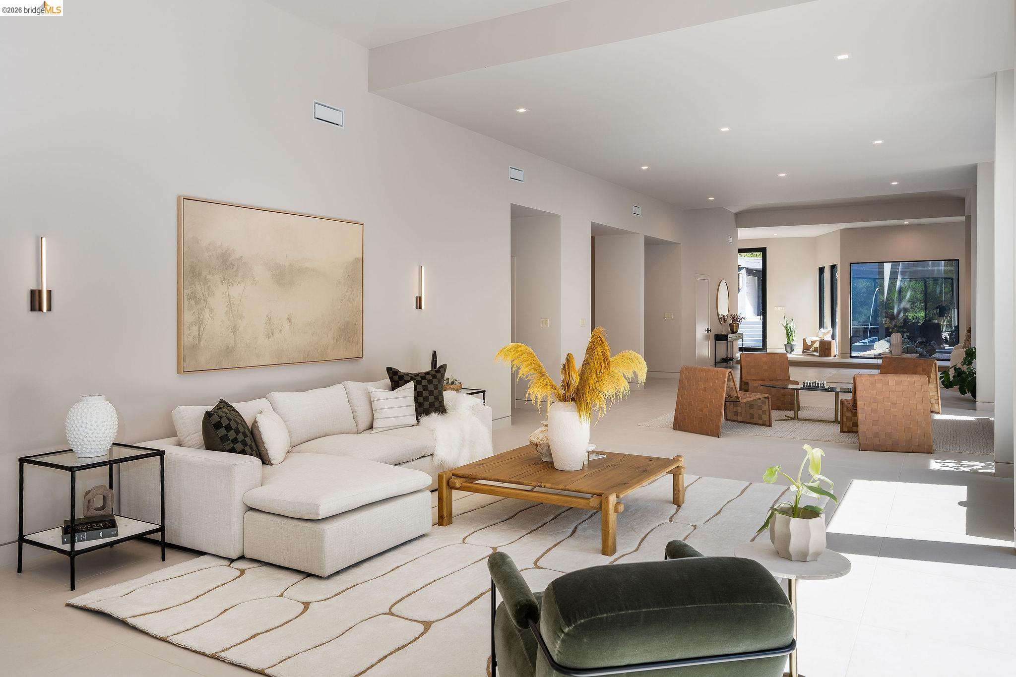 5645 Bacon Road Oakland, CA 94619 - Photo 18 of 94 Spacious living area featuring high ceilings, recessed lighting, neutral wall tones, and light-toned flooring