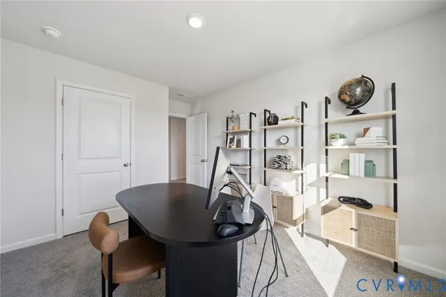 a view of a workspace with furniture