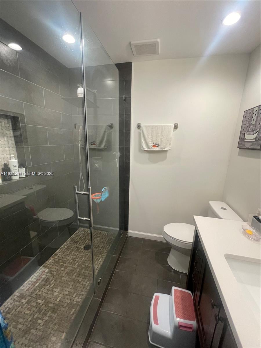 2730 Adams Street Hollywood, FL 33020 - Photo 4 of 8 a bathroom with a sink toilet and shower