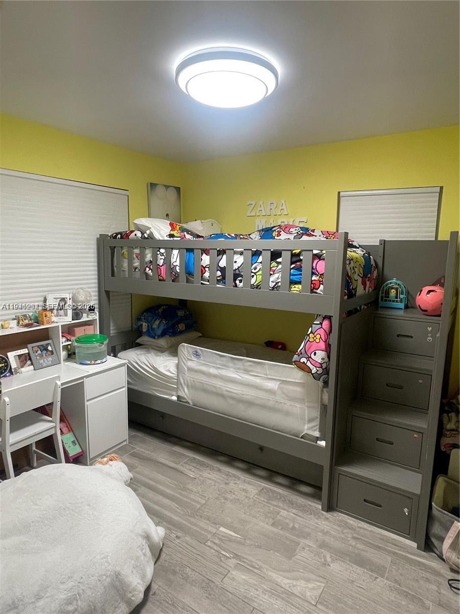 2730 Adams Street Hollywood, FL 33020 - Photo 6 of 8 a bedroom with a bed and a dresser