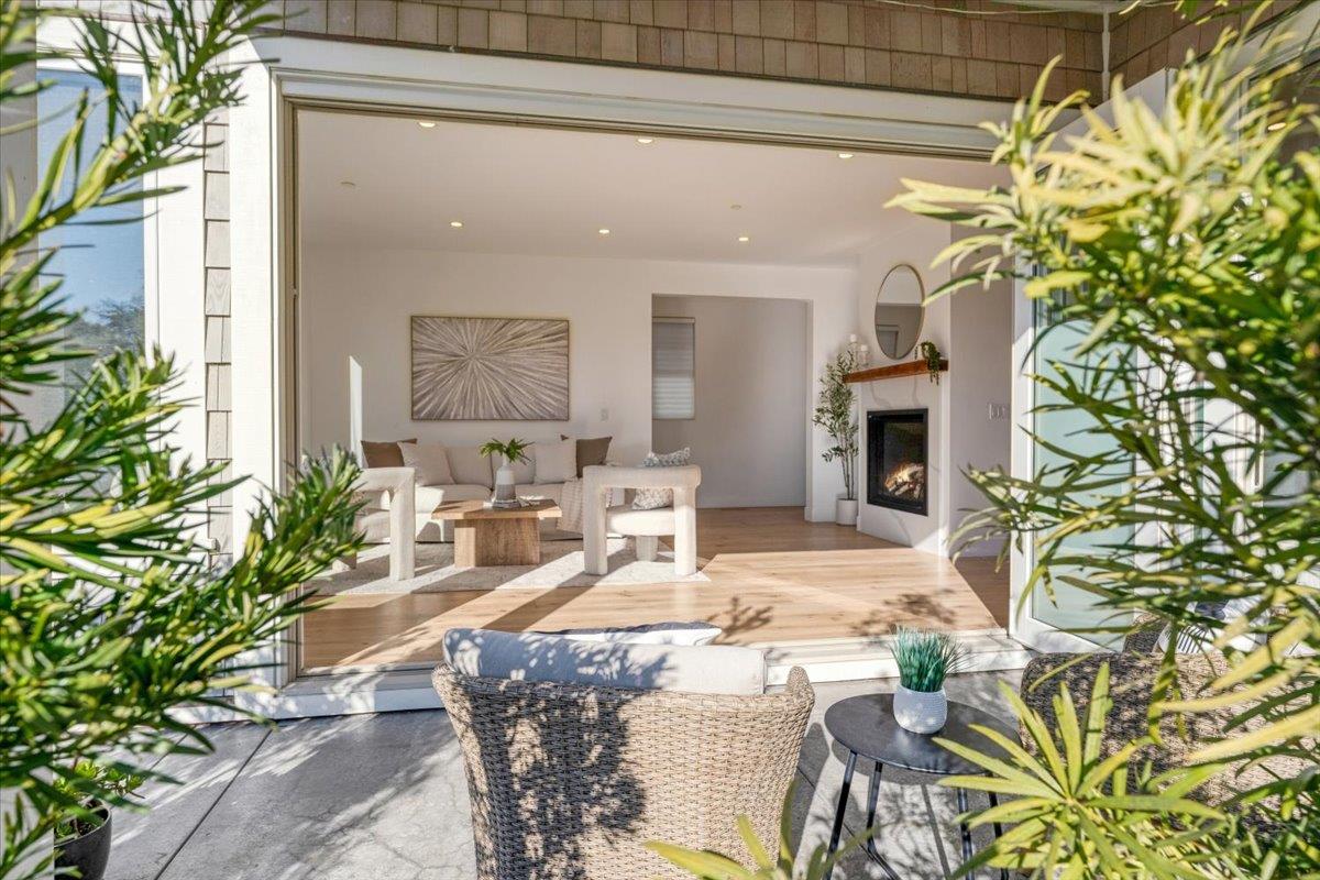 100 Bay Crest Road Santa Cruz, CA 95062 - Photo 15 of 62 a living room with fireplace furniture and a potted plant