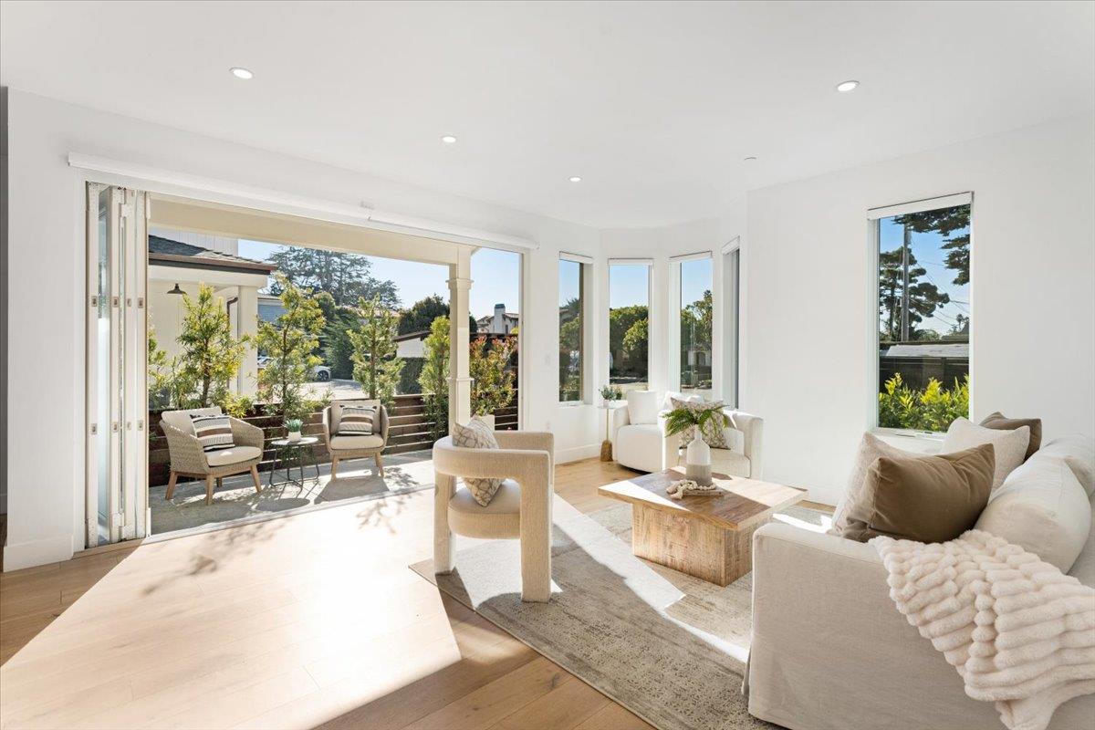 100 Bay Crest Road Santa Cruz, CA 95062 - Photo 17 of 62 a living room with furniture and large windows