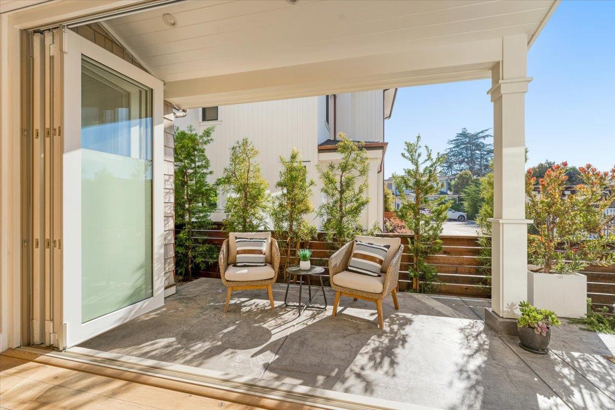 100 Bay Crest Road Santa Cruz, CA 95062 - Photo 18 of 62 a view of a porch with chairs and potted plants