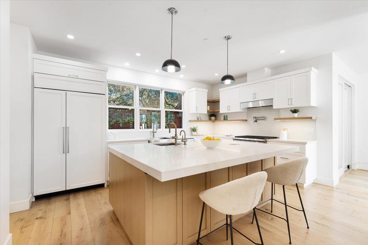 100 Bay Crest Road Santa Cruz, CA 95062 - Photo 25 of 62 a kitchen with stainless steel appliances granite countertop a sink a stove a refrigerator and island with wooden floor