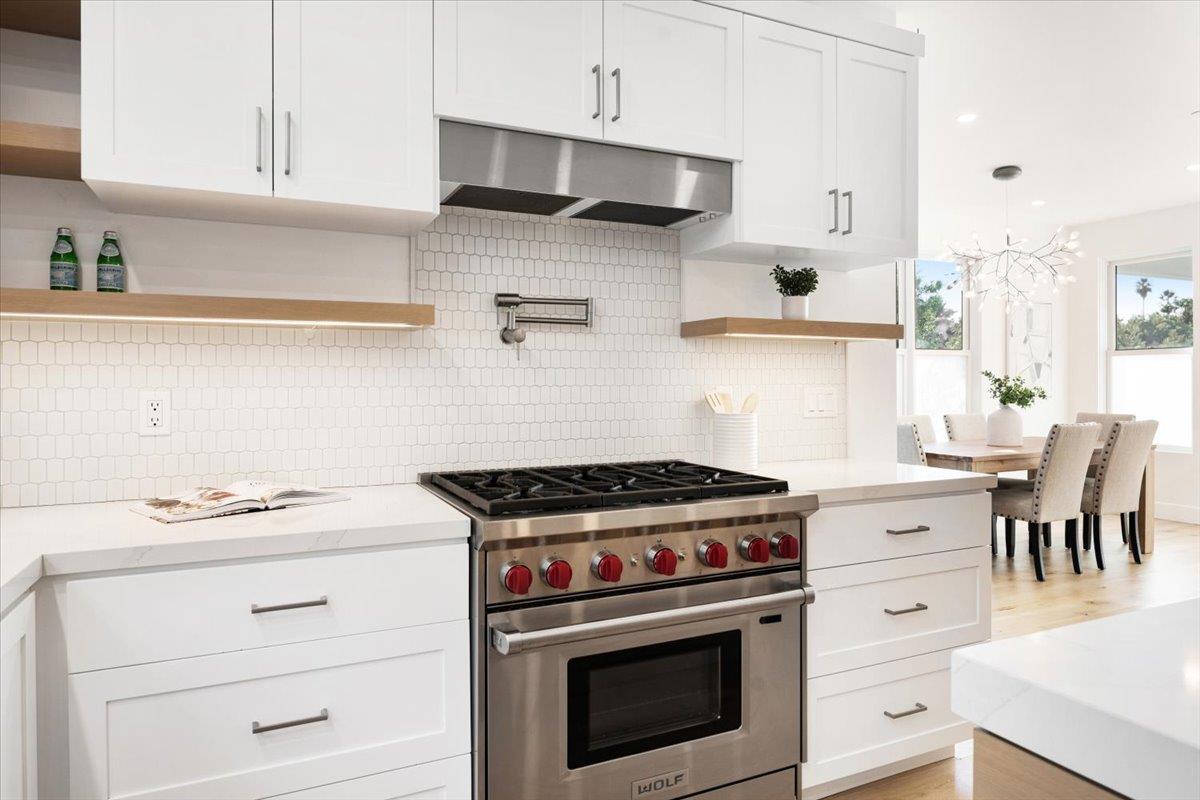 100 Bay Crest Road Santa Cruz, CA 95062 - Photo 27 of 62 a white stove top oven sitting inside of a kitchen