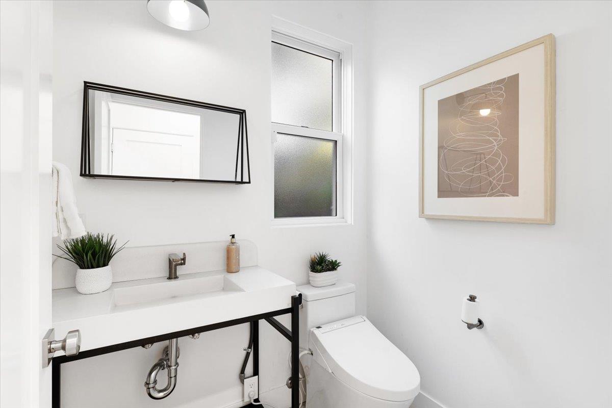 100 Bay Crest Road Santa Cruz, CA 95062 - Photo 30 of 62 a bathroom with a toilet sink and mirror