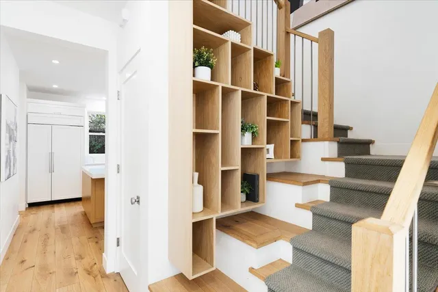 a living room with furniture and large windows