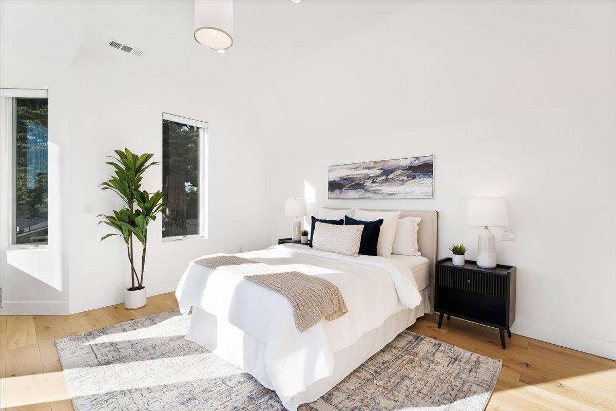 100 Bay Crest Road Santa Cruz, CA 95062 - Photo 35 of 62 a bedroom with a bed and a potted plant
