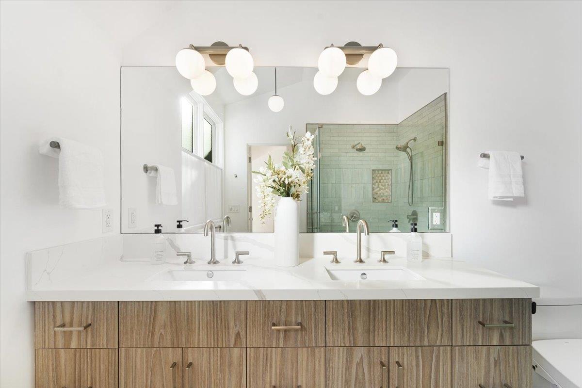 100 Bay Crest Road Santa Cruz, CA 95062 - Photo 39 of 62 a bathroom with a sink double vanity and a mirror