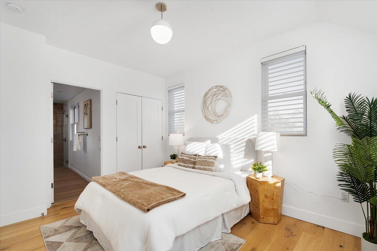100 Bay Crest Road Santa Cruz, CA 95062 - Photo 46 of 62 a bedroom with a bed and a potted plant