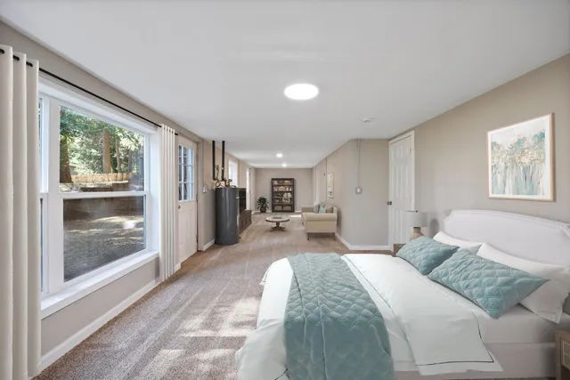 a bed room with a bed and a large window