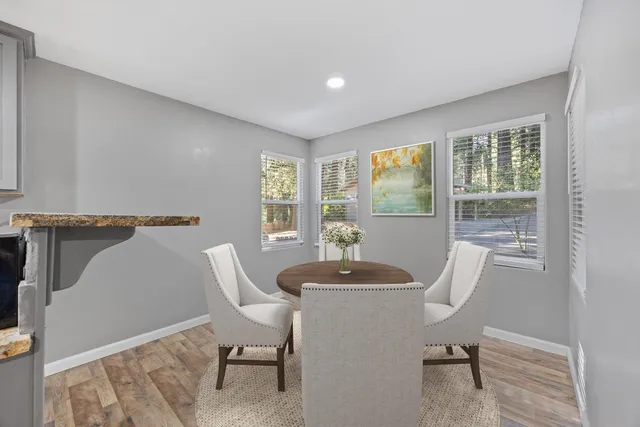 a view of a dining room with furniture window and outside view