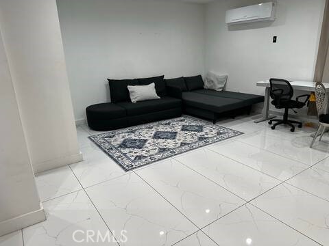 5032 Amestoy Encino, CA 91316 - Photo 11 of 22 a living room with a couch