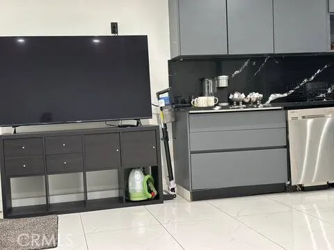 a kitchen with a refrigerator and cabinets