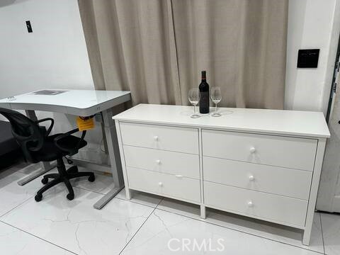 5032 Amestoy Encino, CA 91316 - Photo 17 of 22 a view of a room with a table and chairs