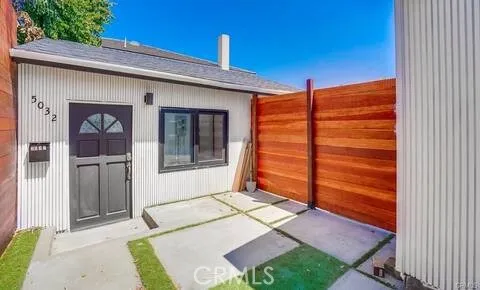 a backyard of a house with seating space