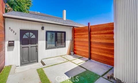 5032 Amestoy Encino, CA 91316 - Photo 2 of 22 a backyard of a house with seating space