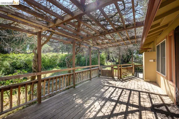 a view of a chairs and tables on the balcony