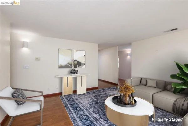 a living room with furniture and a rug