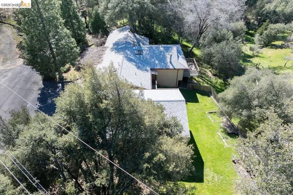 an aerial view of a house with a garden