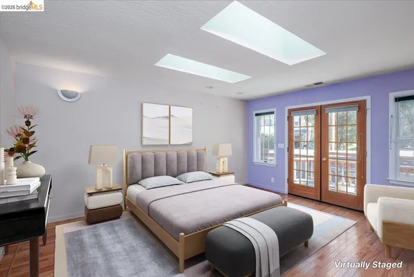 a bedroom with a large bed and a couch