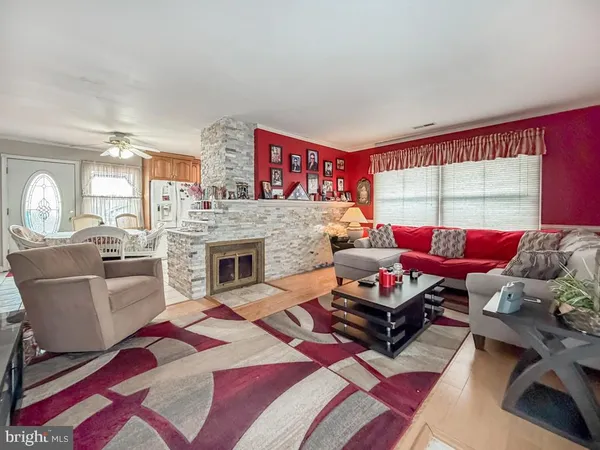 a living room with furniture and a fireplace
