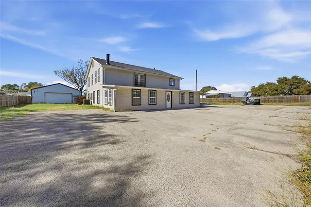 a view of a house with a big yard