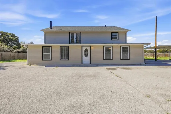 a front view of a house with garage