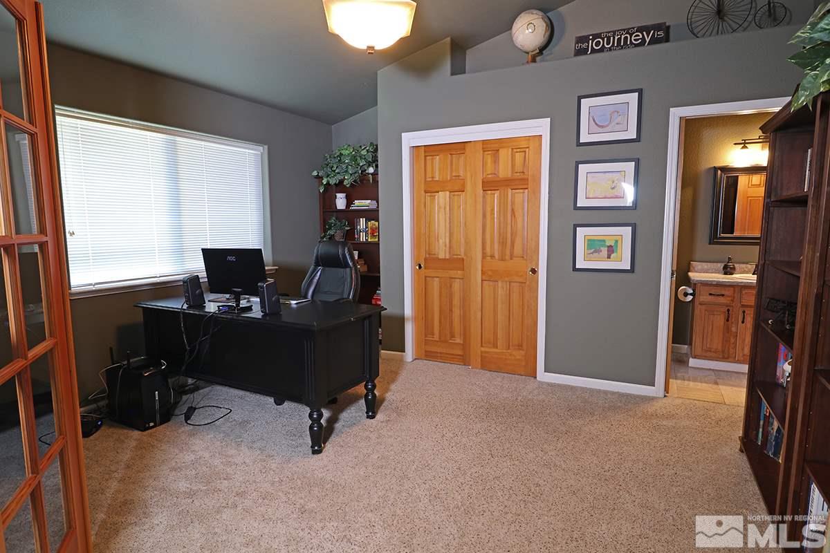 55 Water Lily Court Reno, NV 89511 - Photo 19 of 25 a view of a workspace with furniture and a window