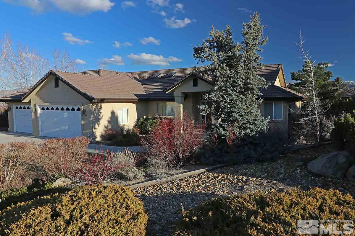 55 Water Lily Court Reno, NV 89511 - Photo 3 of 25 a front view of a house with garden