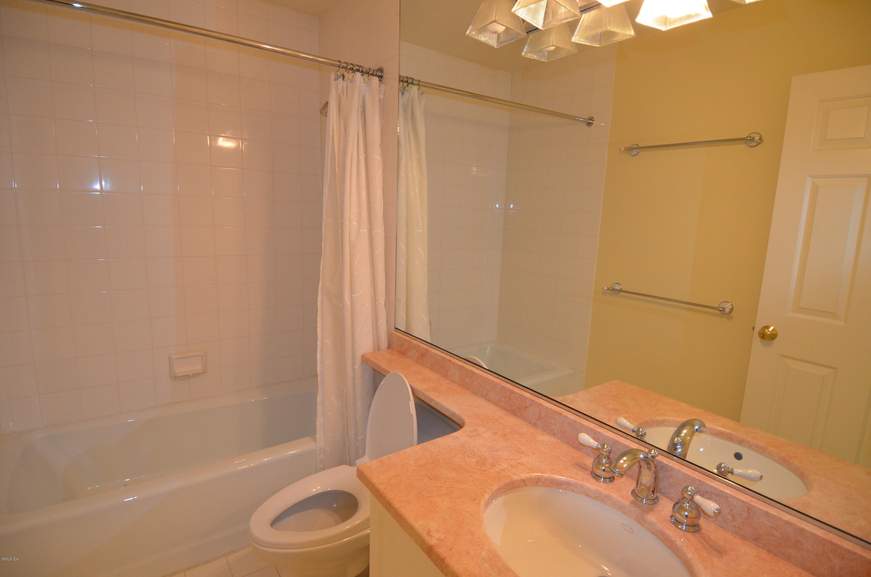 115 River Road, Unit 10 Cos Cob, CT 06807 - Photo 12 of 19 a bathroom with a granite countertop sink toilet and shower