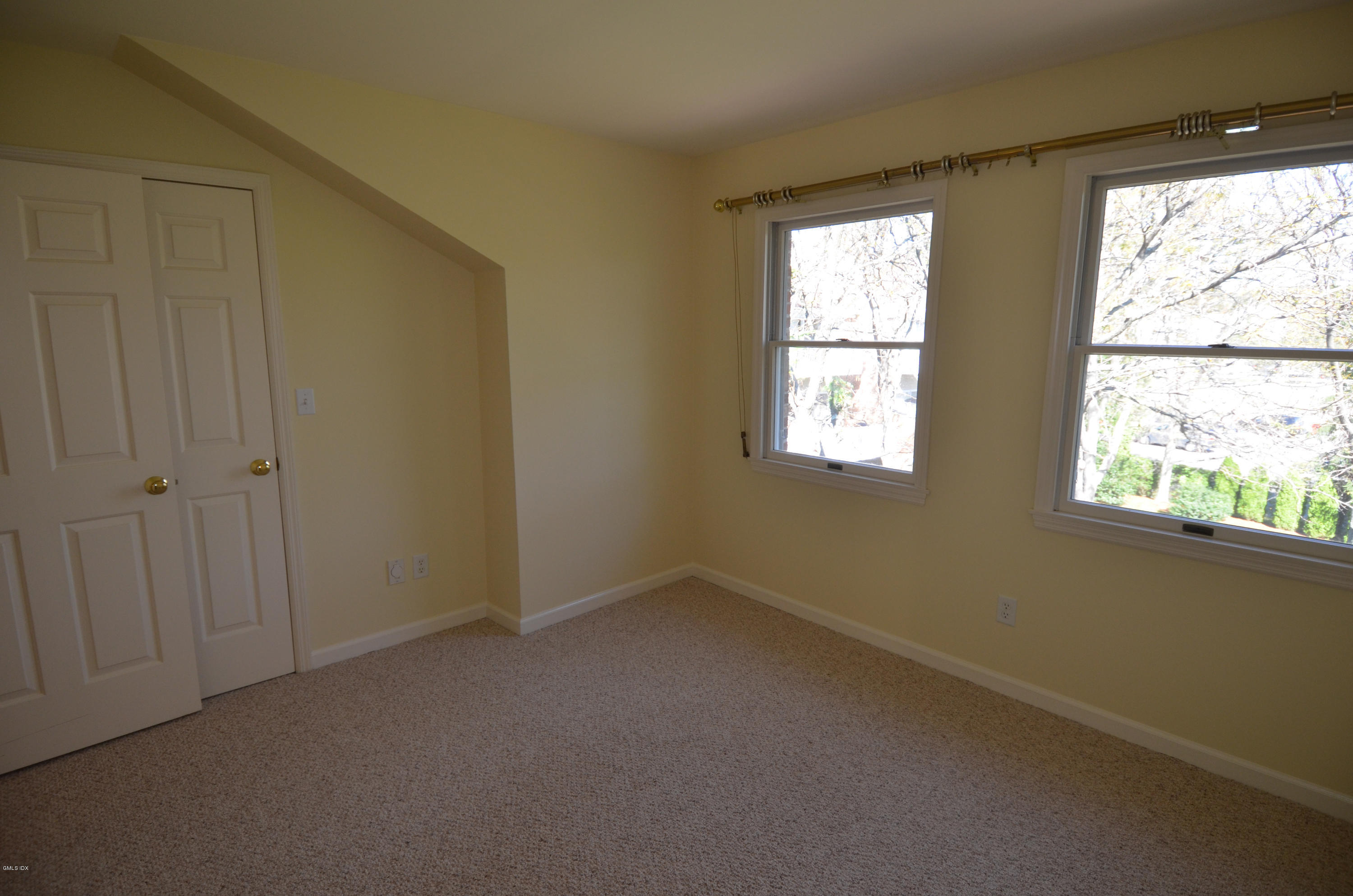 115 River Road, Unit 10 Cos Cob, CT 06807 - Photo 13 of 19 an empty room with windows
