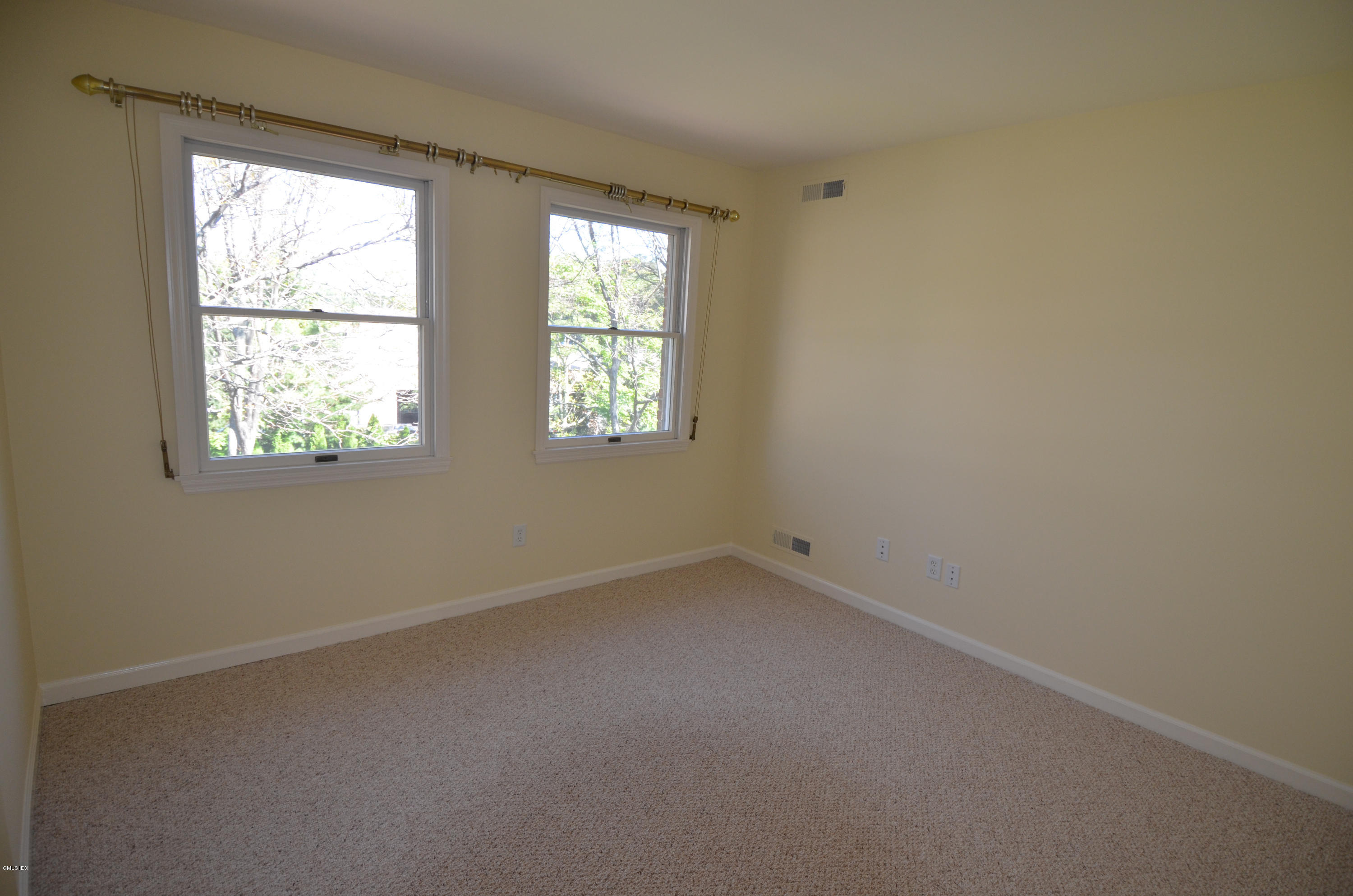 115 River Road, Unit 10 Cos Cob, CT 06807 - Photo 14 of 19 an empty room with a window