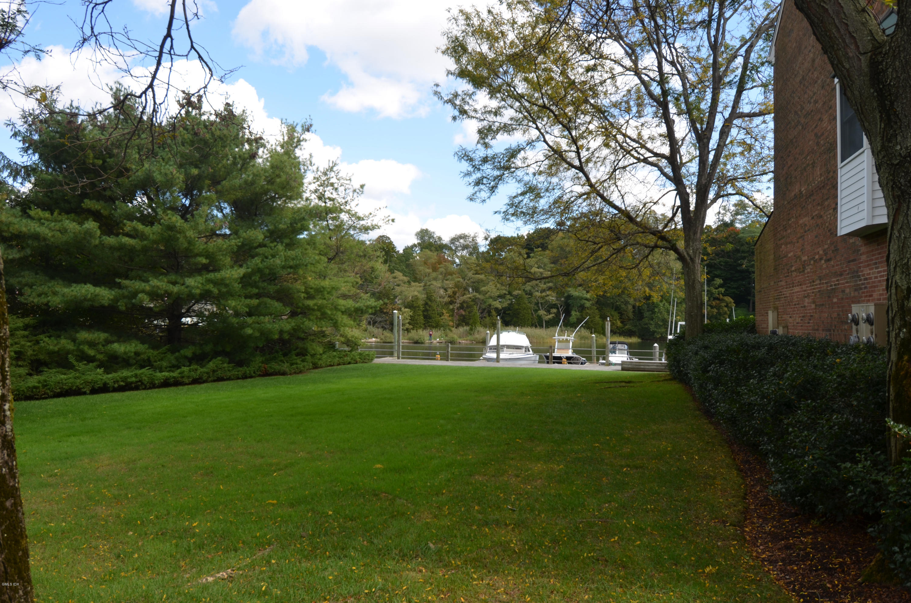 115 River Road, Unit 10 Cos Cob, CT 06807 - Photo 18 of 19 a view of a grassy field