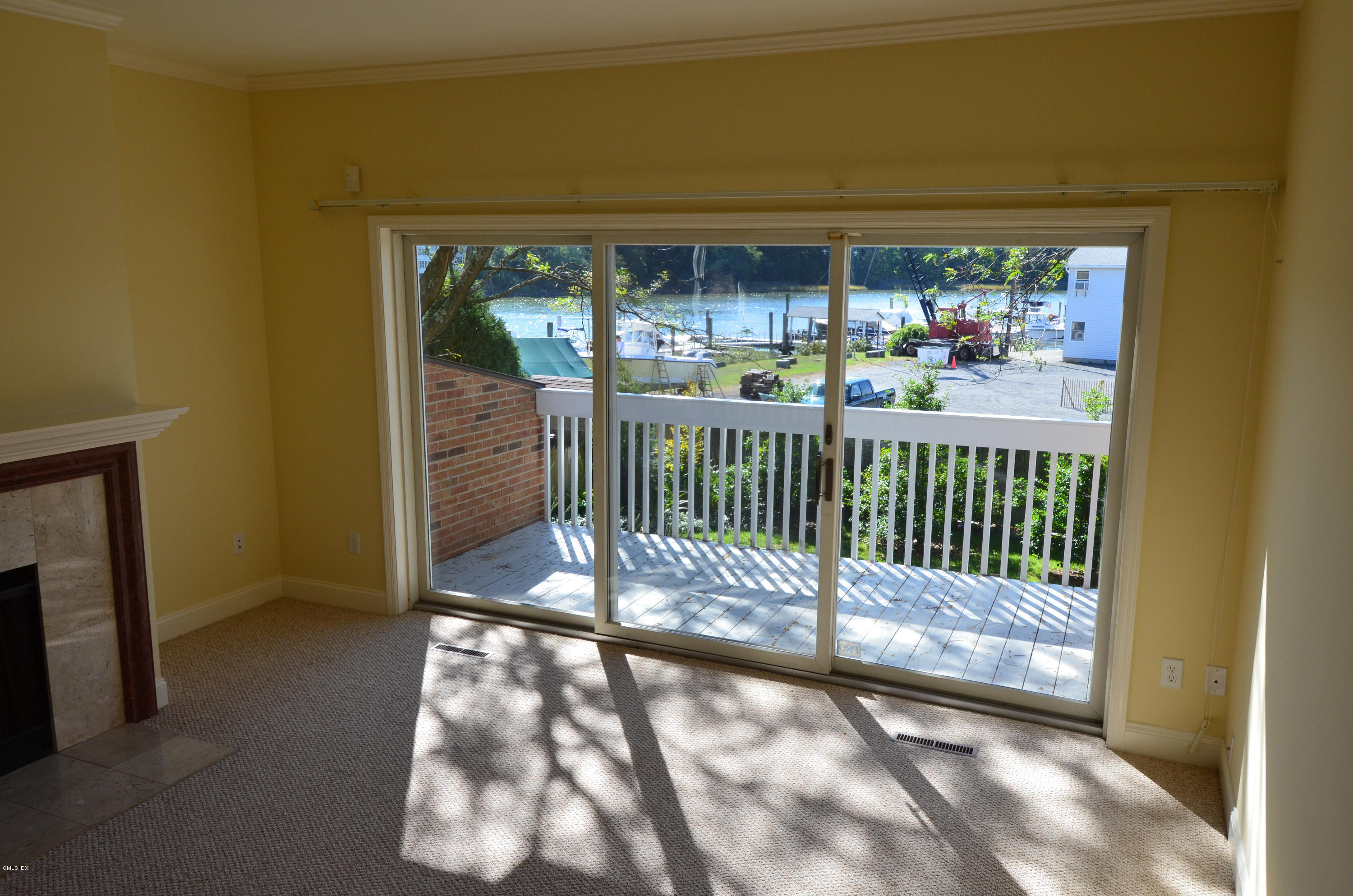 115 River Road, Unit 10 Cos Cob, CT 06807 - Photo 3 of 19 a view of a street from a room