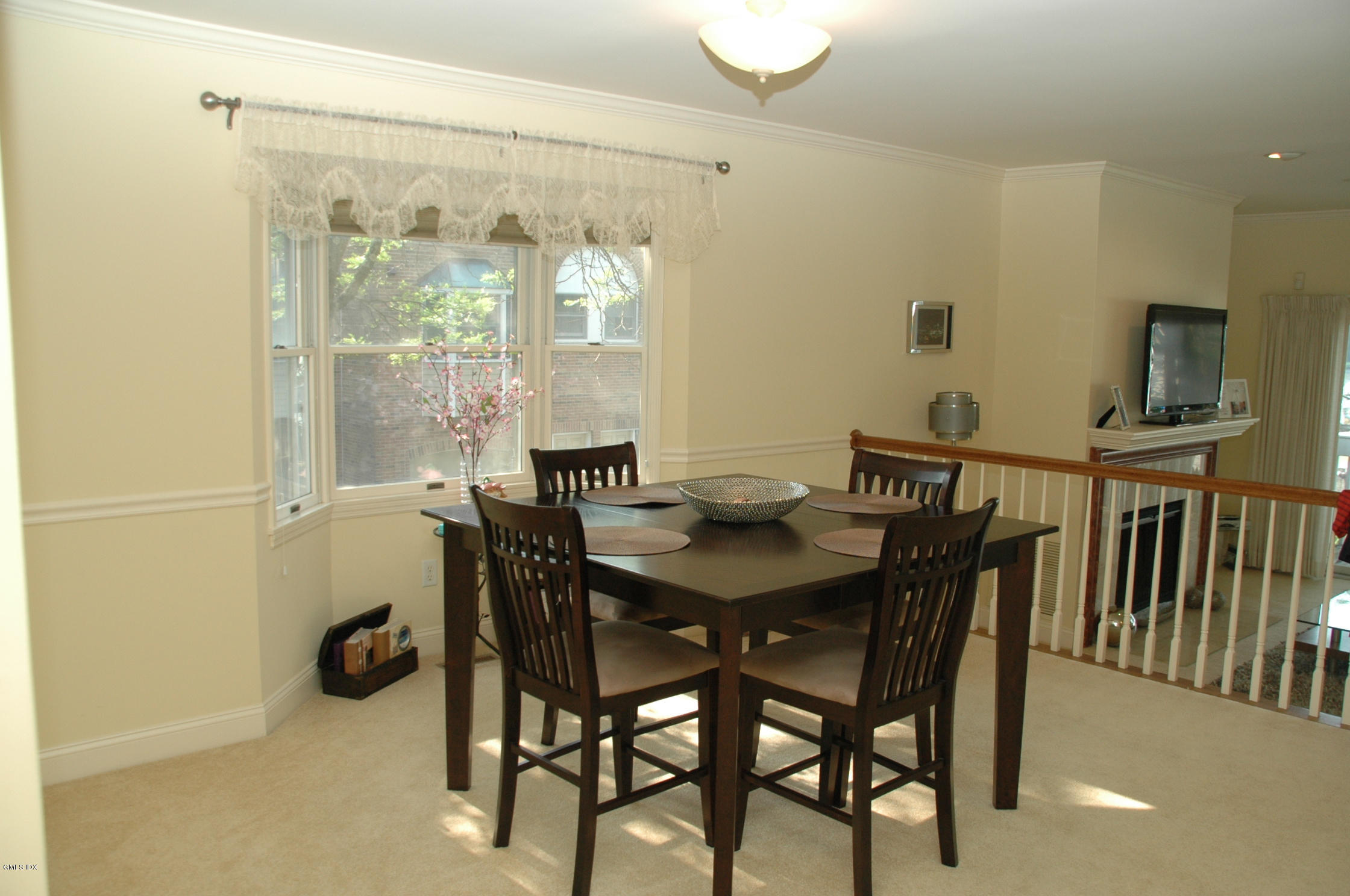 115 River Road, Unit 10 Cos Cob, CT 06807 - Photo 5 of 19 a view of a dining room with furniture and wooden floor
