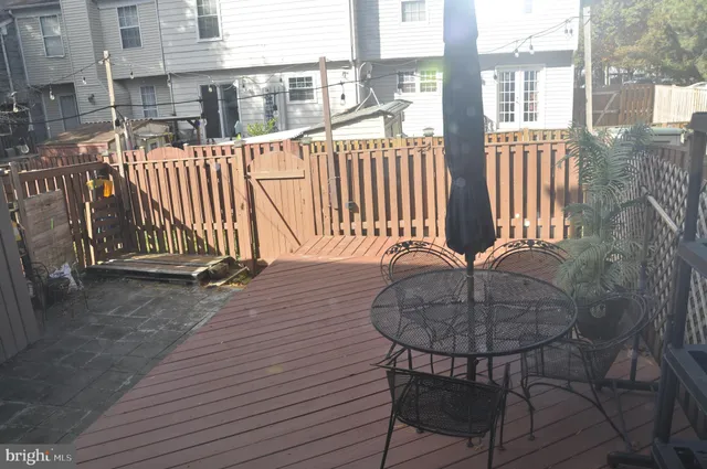 a balcony with table and chairs
