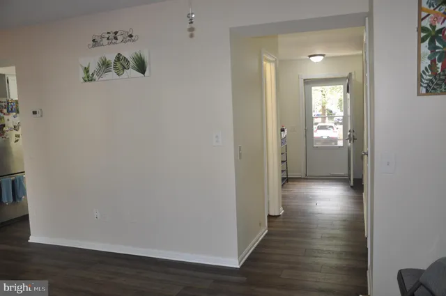 a view of an entryway with wooden floor