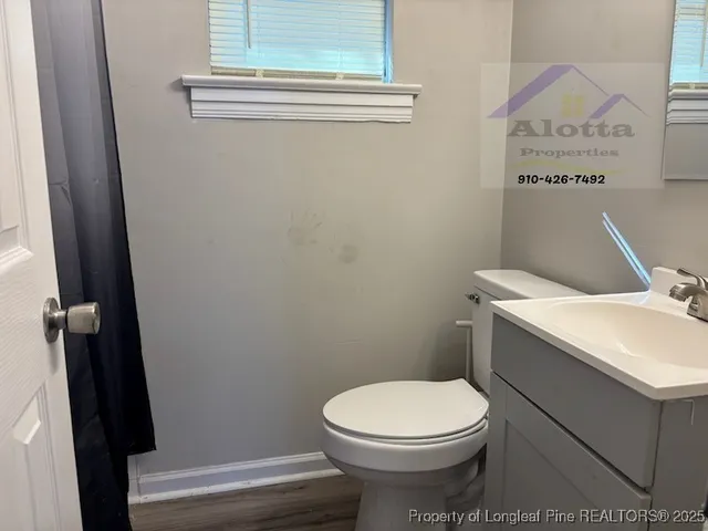 a bathroom with a toilet and a sink