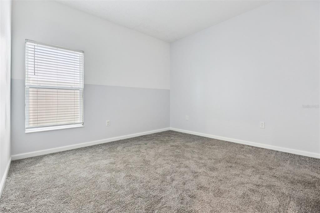 781 Taurus Lane St. Cloud, FL 34772 - Photo 18 of 36 an empty room with a window