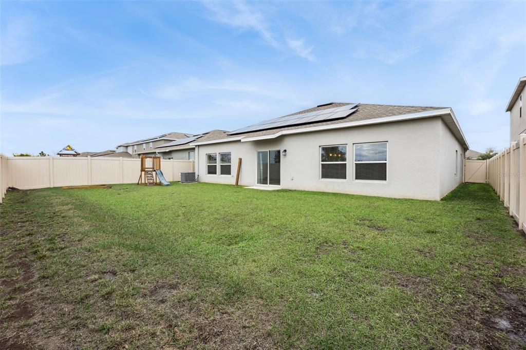 781 Taurus Lane St. Cloud, FL 34772 - Photo 26 of 36 a house view with a garden space