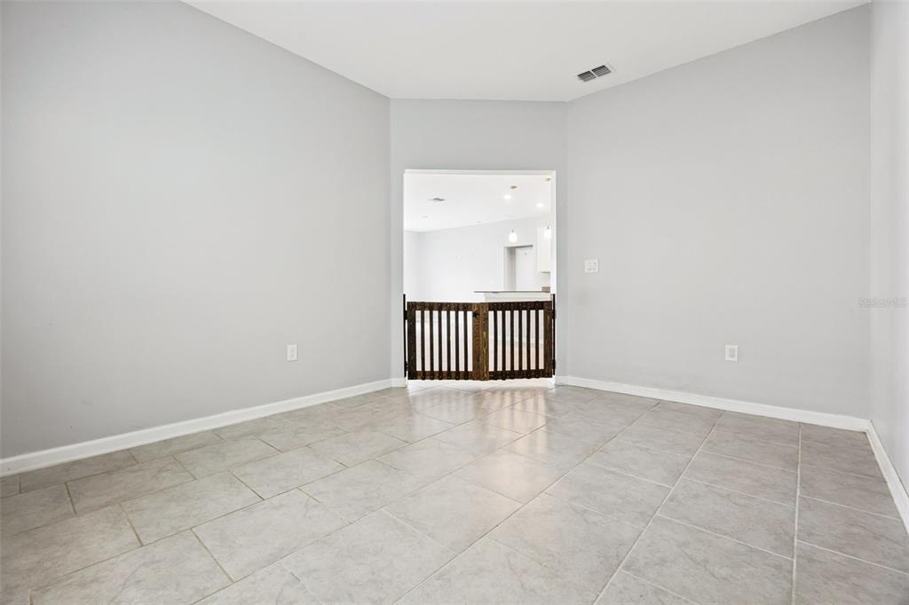 781 Taurus Lane St. Cloud, FL 34772 - Photo 4 of 36 an empty room with a window