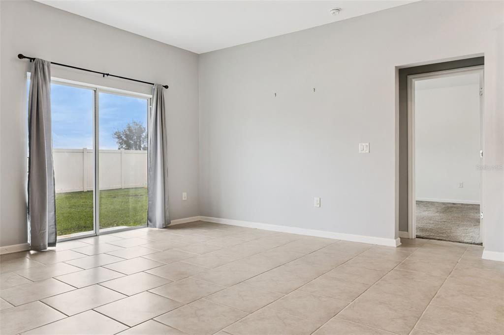 781 Taurus Lane St. Cloud, FL 34772 - Photo 7 of 36 a view of an empty room and window