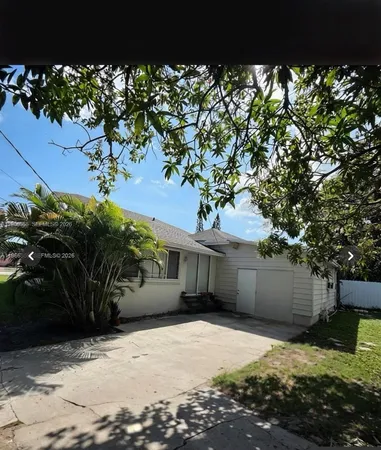 a view of a house with a tree