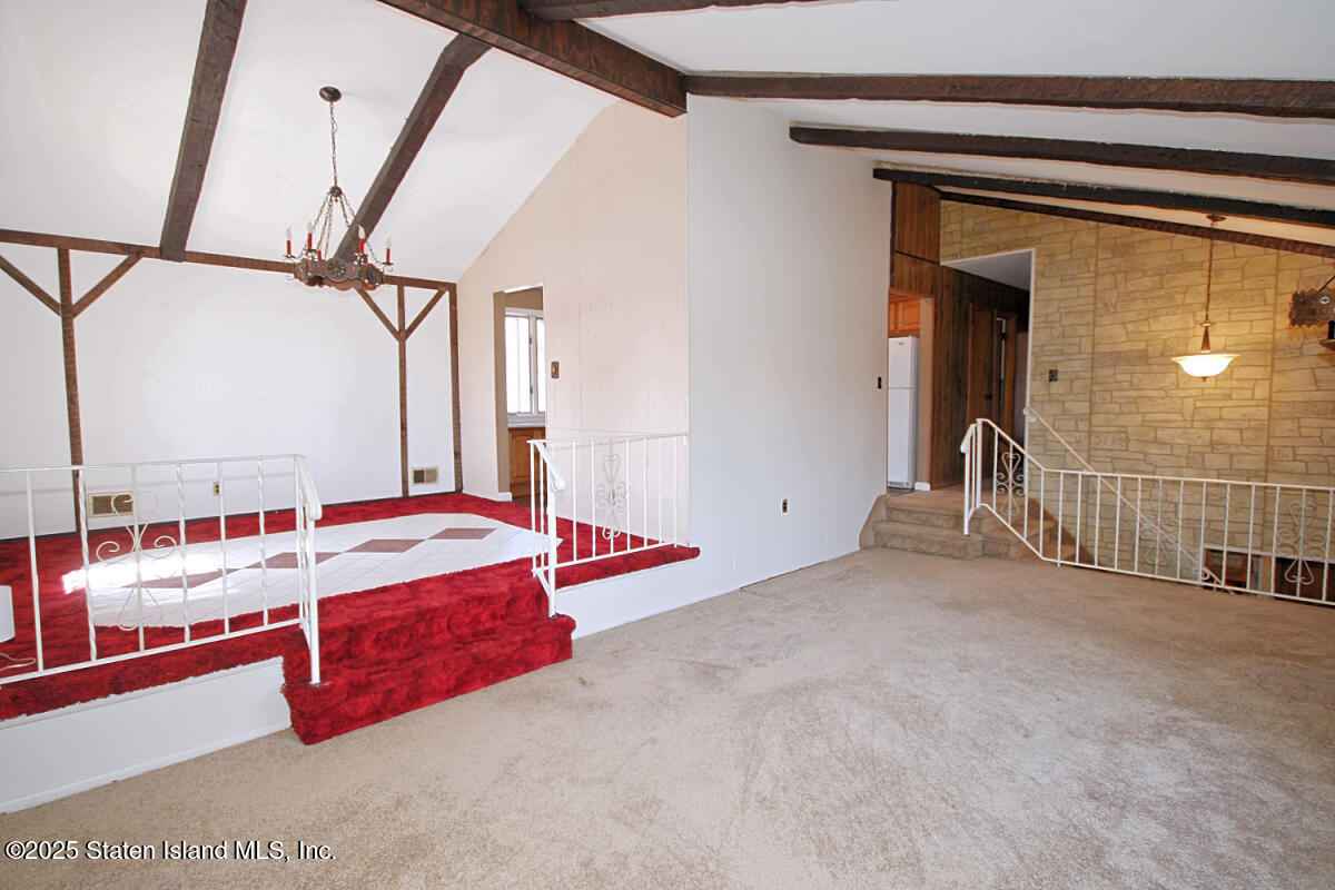 3 Windermere Road Staten Island, NY 10305 - Photo 11 of 37 a room with a bed and a table