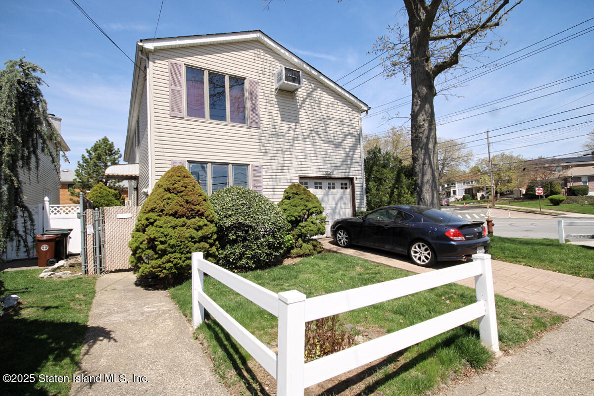 3 Windermere Road Staten Island, NY 10305 - Photo 21 of 37 a view of a white house with a yard and sitting area
