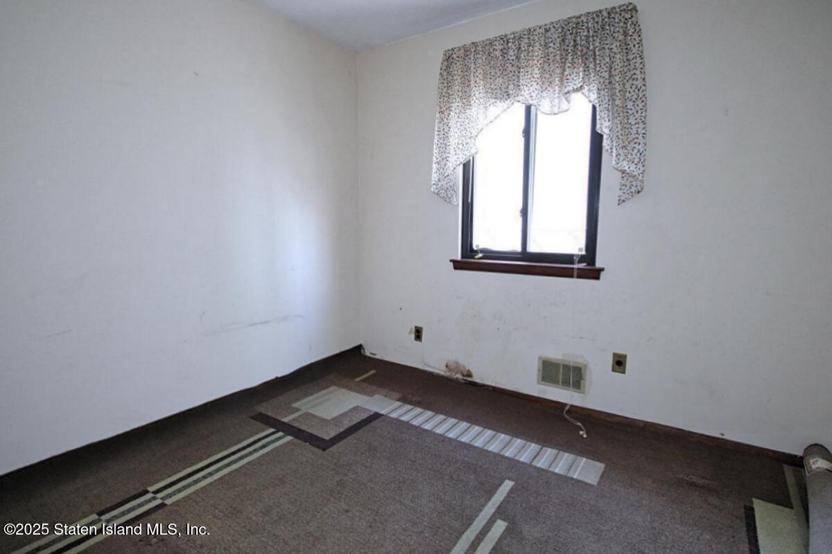 3 Windermere Road Staten Island, NY 10305 - Photo 28 of 37 an empty room with windows
